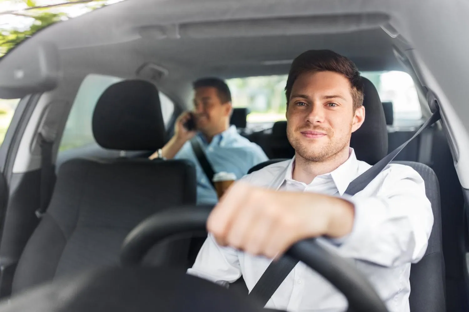 Driver behind the wheel on an open highway